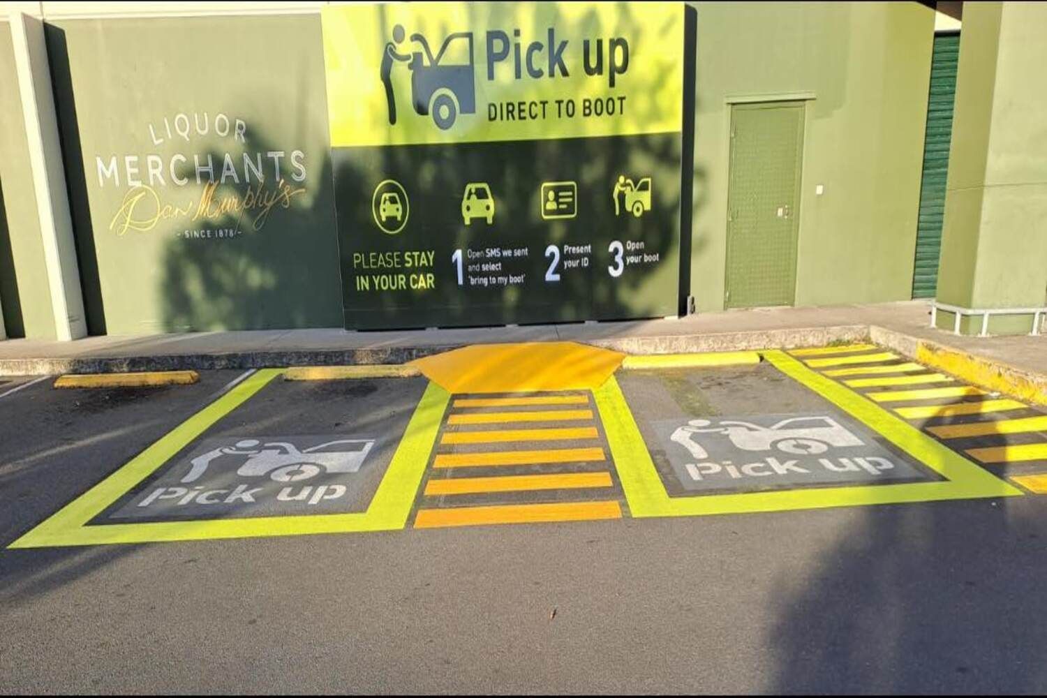 A Parking Lot With A Sign That Says Pick Up On It — Spraywayz Linemarking Pty Ltd In Booral, QLD