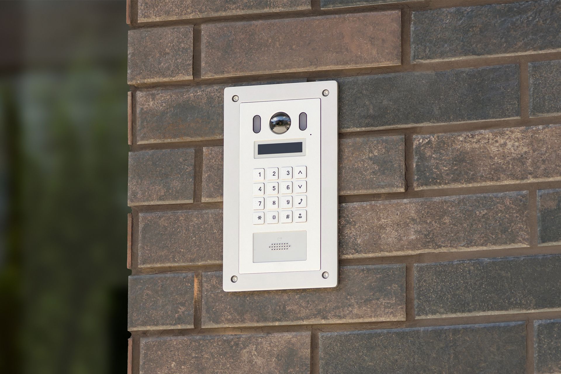 White intercom system with keypad, camera and speaker