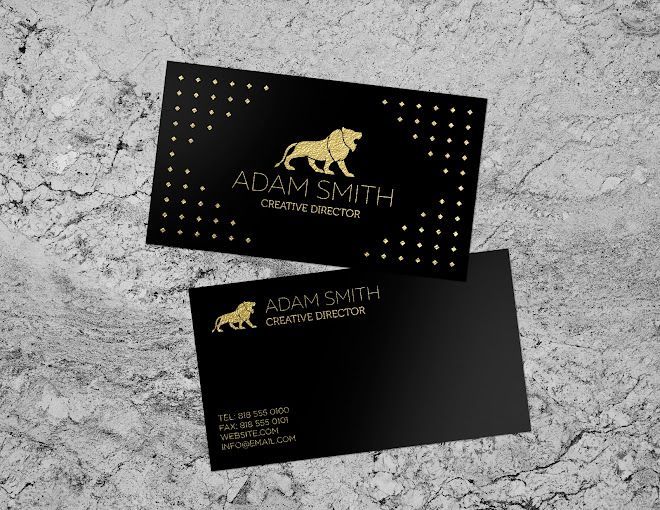 A black business card with a gold lion on it