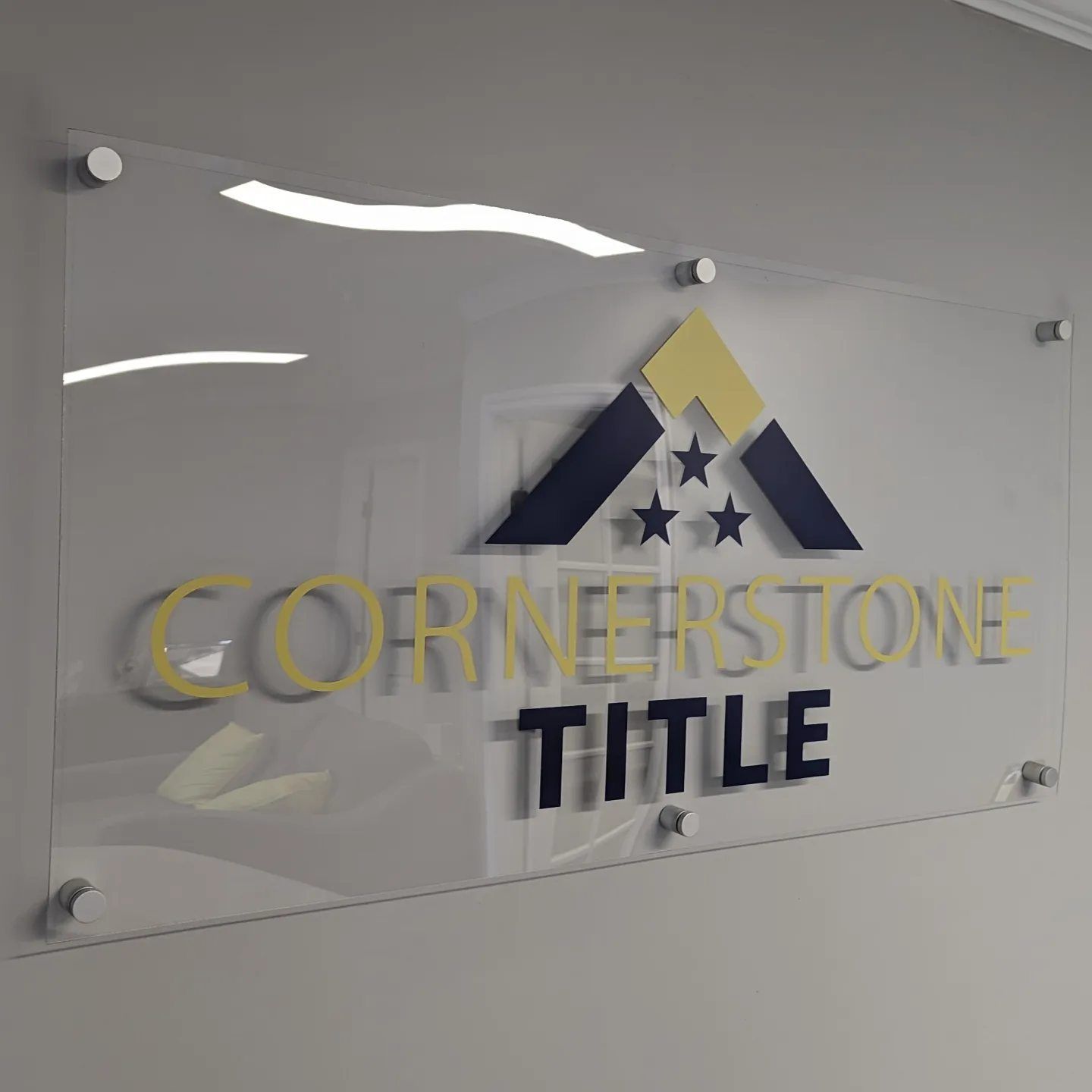 A clear sign that says cornerstone title on it