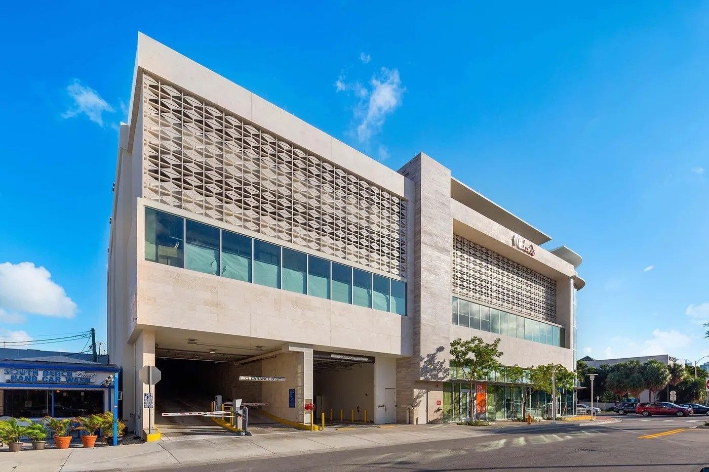 A large building with palm trees in front of it