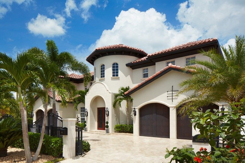 A house with two windows and a chimney on the roof