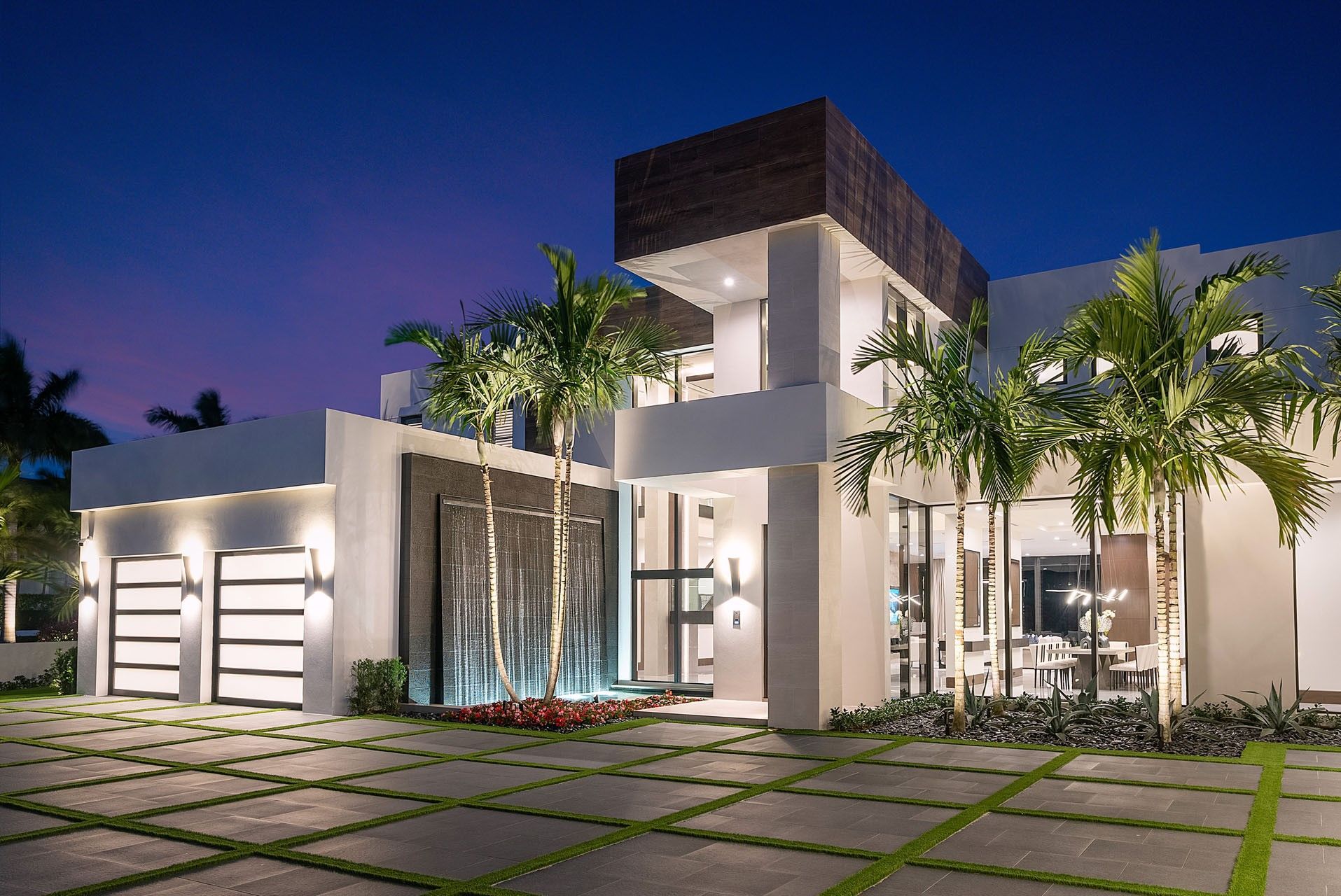 Looking up at a white building with a blue sky in the background