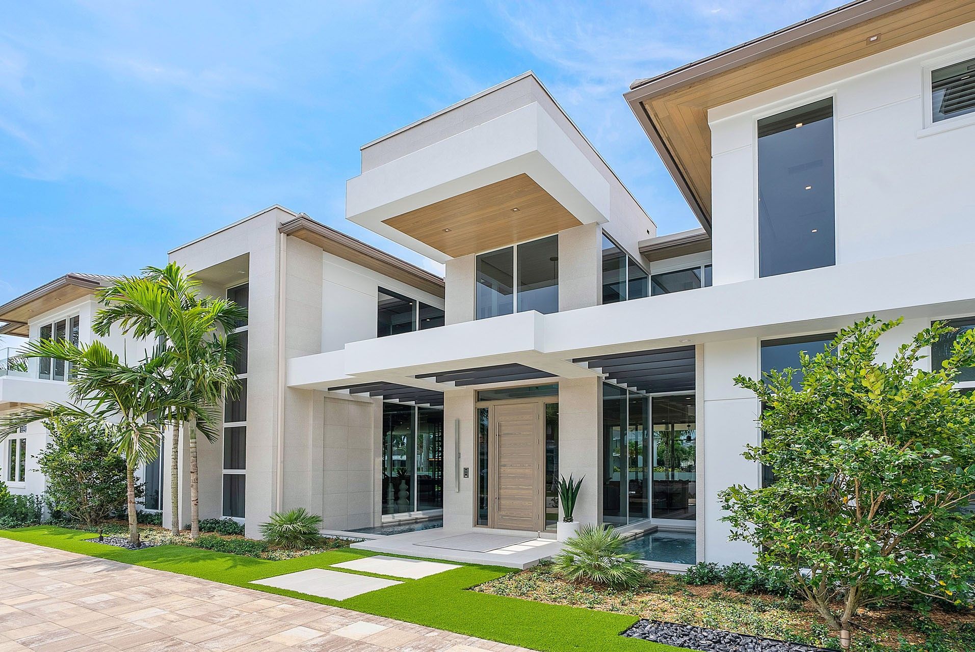 Looking up at the roof of a house with a blue sky in the background