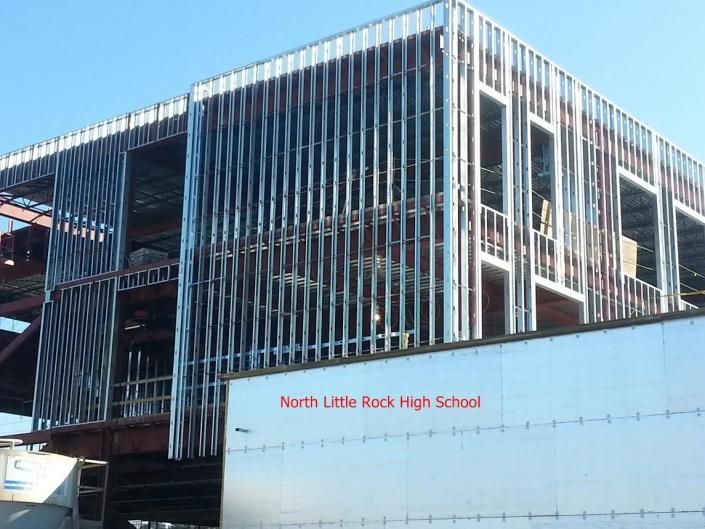 A view of a North Little Rock High School building under construction with metal framing visible on a sunny day.