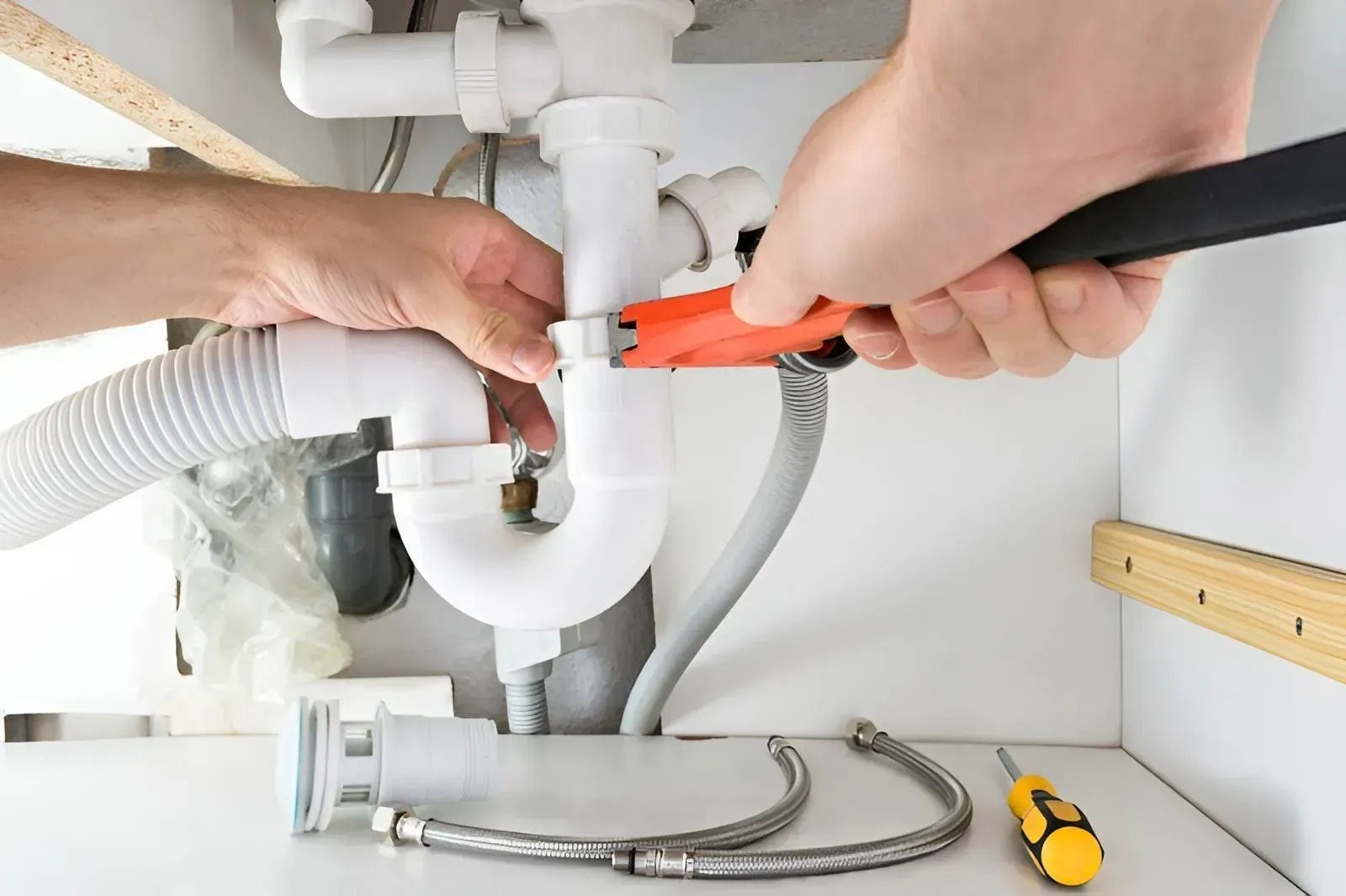 White Plastic Plumbing P-Trap Pipe Under a Sink. — Dunnrite Plumbing Services in Proserpine, QLD