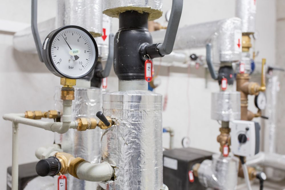 Close-up of Industrial Pipe Insulation, Pressure Gauge on a Vessel — Dunnrite Plumbing Services in Proserpine, QLD