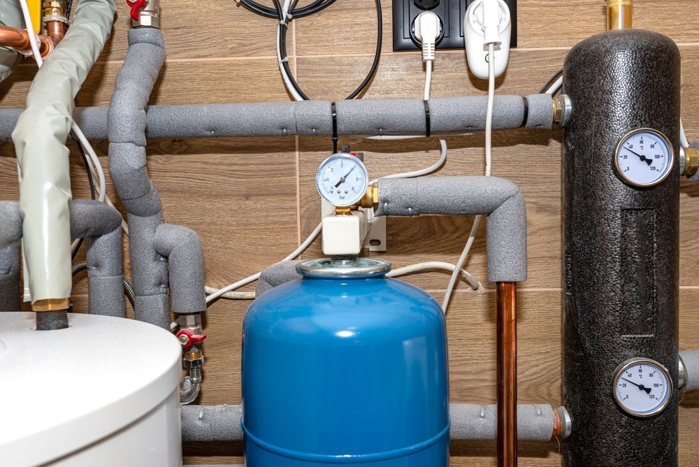 A Blue Expansion Tank With a Pressure Gauge Installed in a Residential — Dunnrite Plumbing Services in Airlie Beach, QLD
