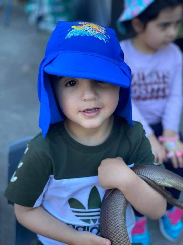 Little boy with snake