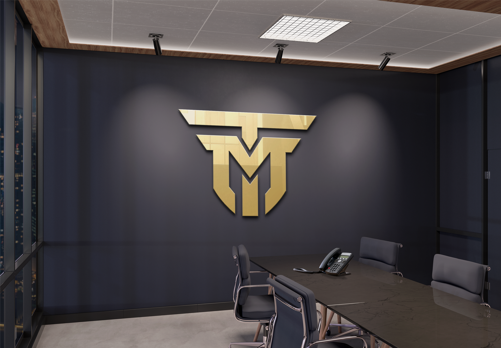 A conference room with a large T&M Logo on the wall