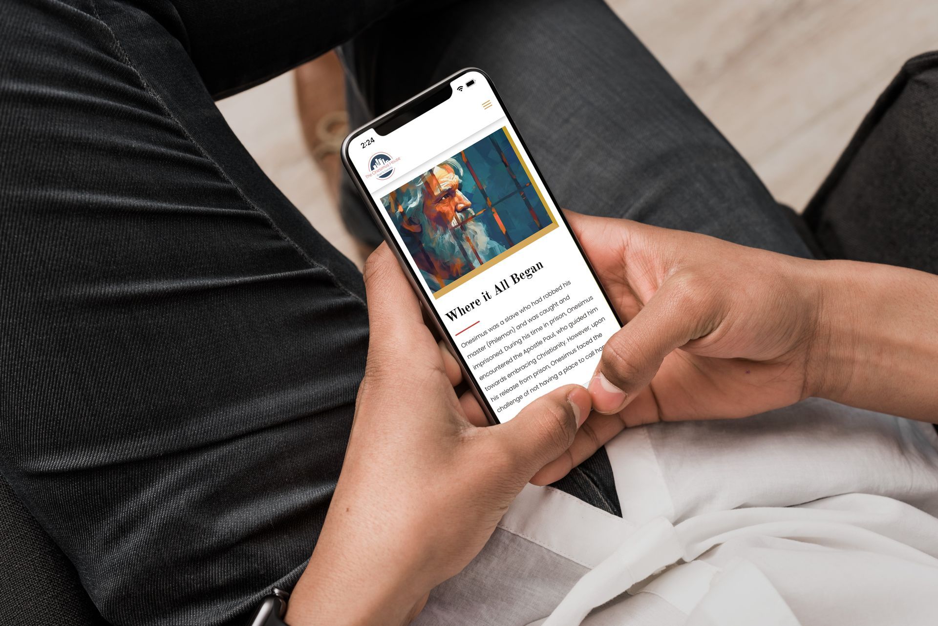 A person is holding a cell phone with a picture of vincent van gogh on the screen.