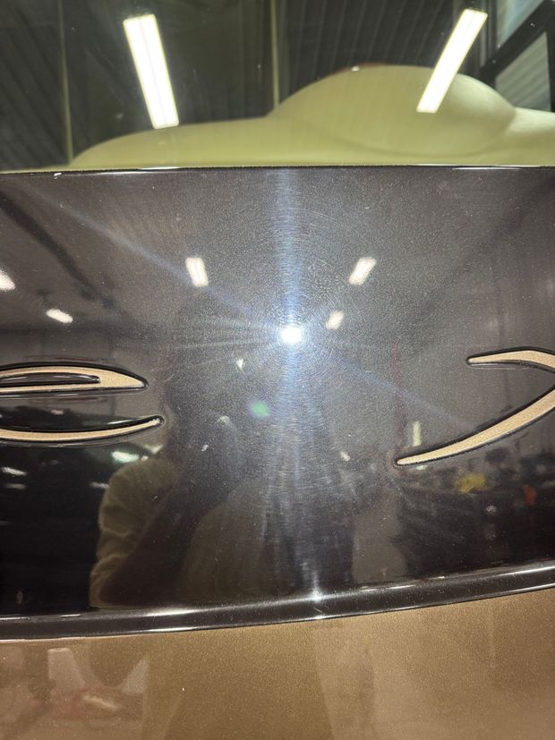 A close up of the back of a car with the letter s on it