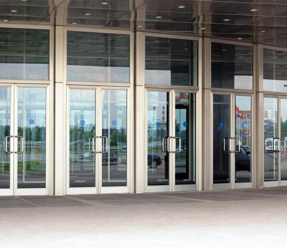 A large building with a lot of glass doors