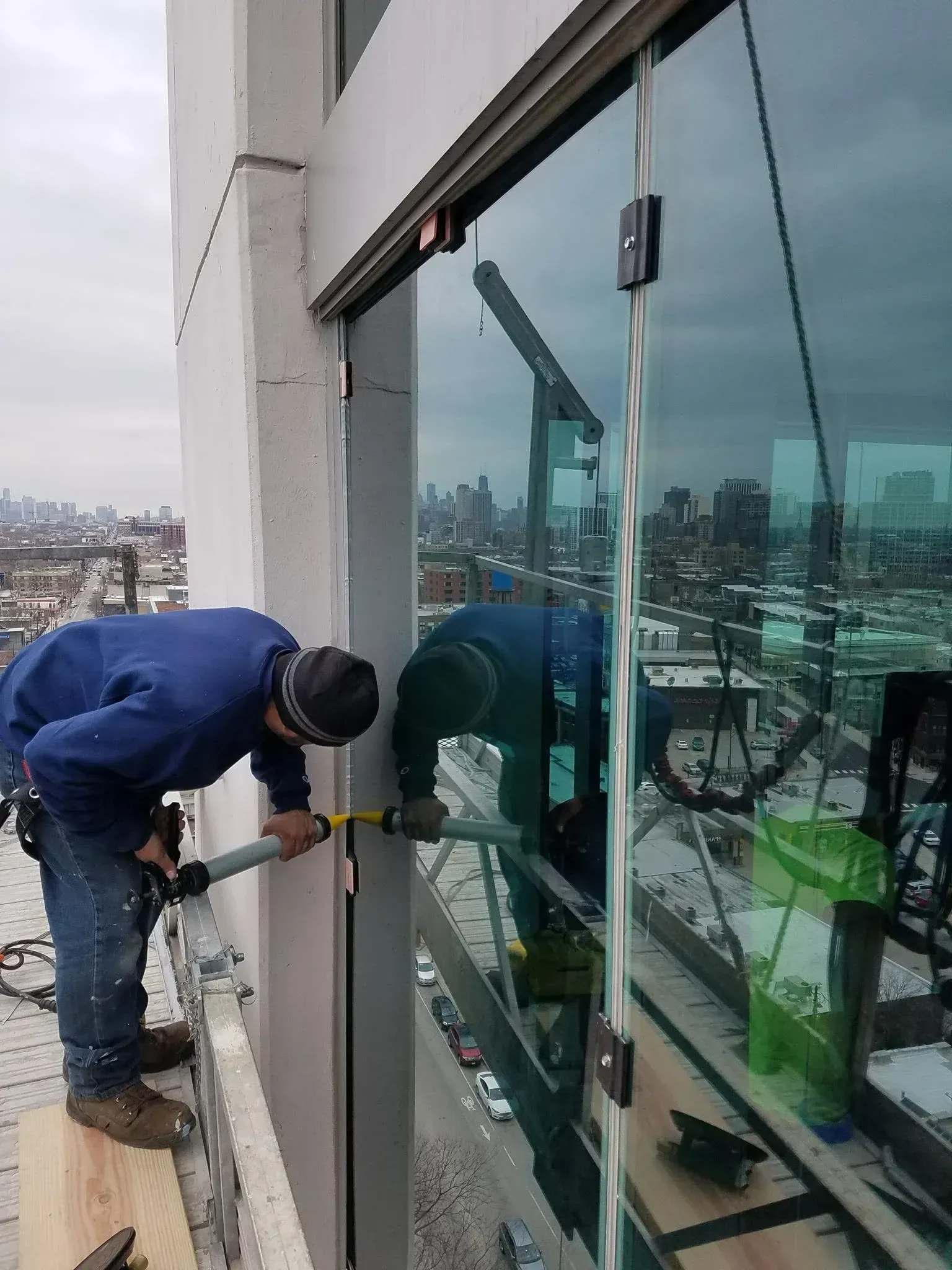 Technician repairing a commercial door closer in Chicago