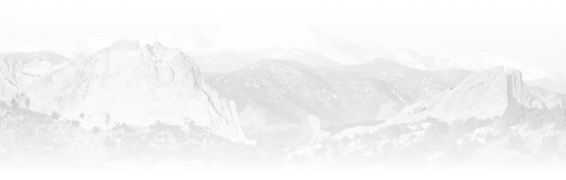 A black and white photo of a mountain range covered in snow. | R&D Auto Care Inc.
