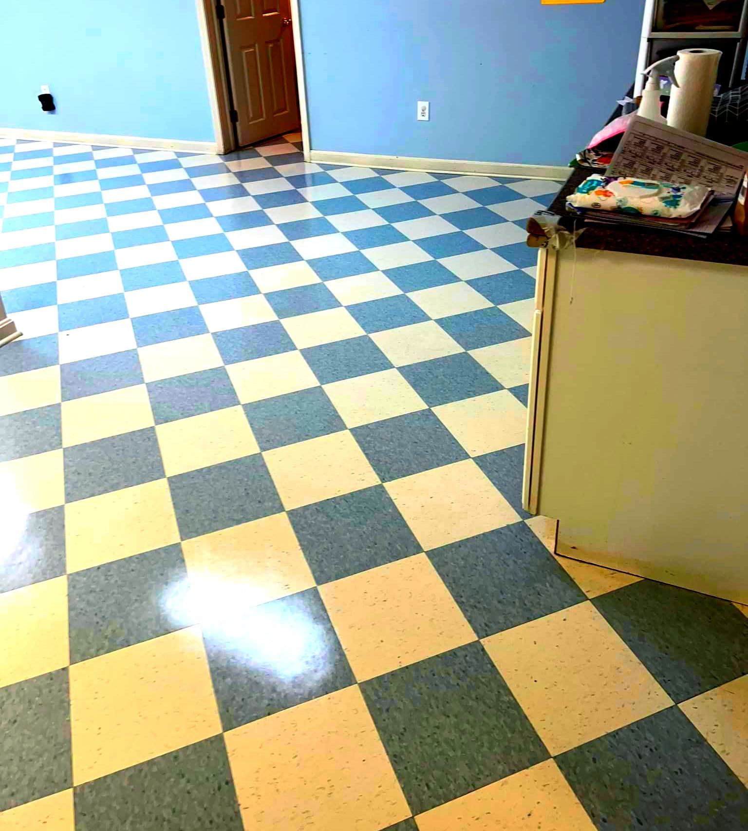 A blue and yellow checkered floor in a kitchen