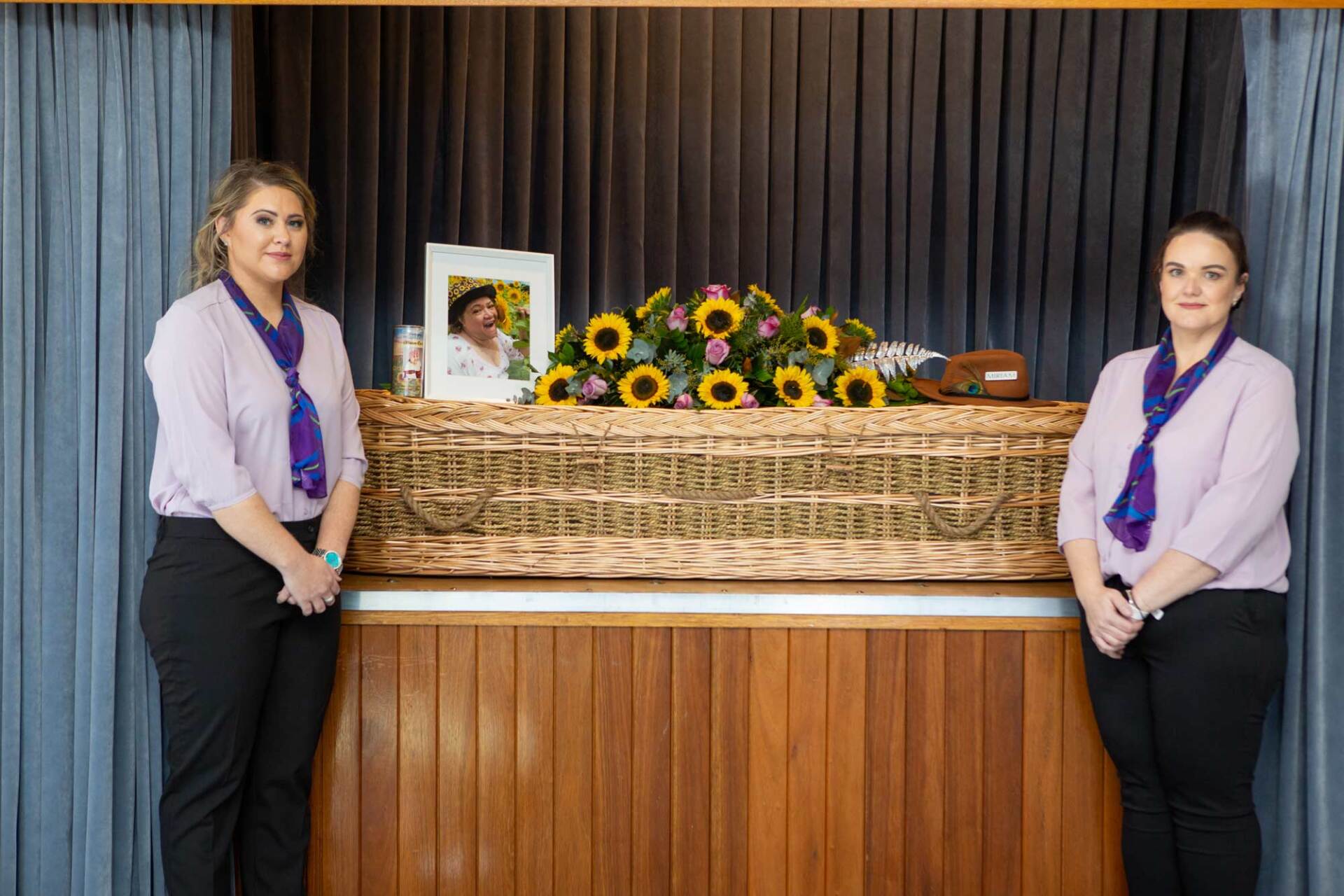 Two Woman Standing Beside A Wicker Coffin | Coffs Harbour, NSW | Lavender Rose Funerals