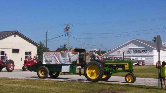 Frank Burch driving tractor in Palmyra Parade