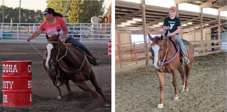 A woman is riding a horse next to a red barrel.