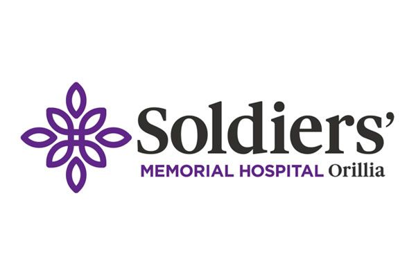 The logo for soldiers memorial hospital orillia has a purple flower on it.