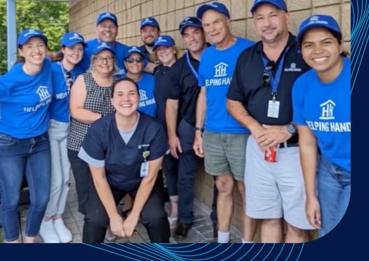 A group of people wearing blue shirts that say alpine vanity