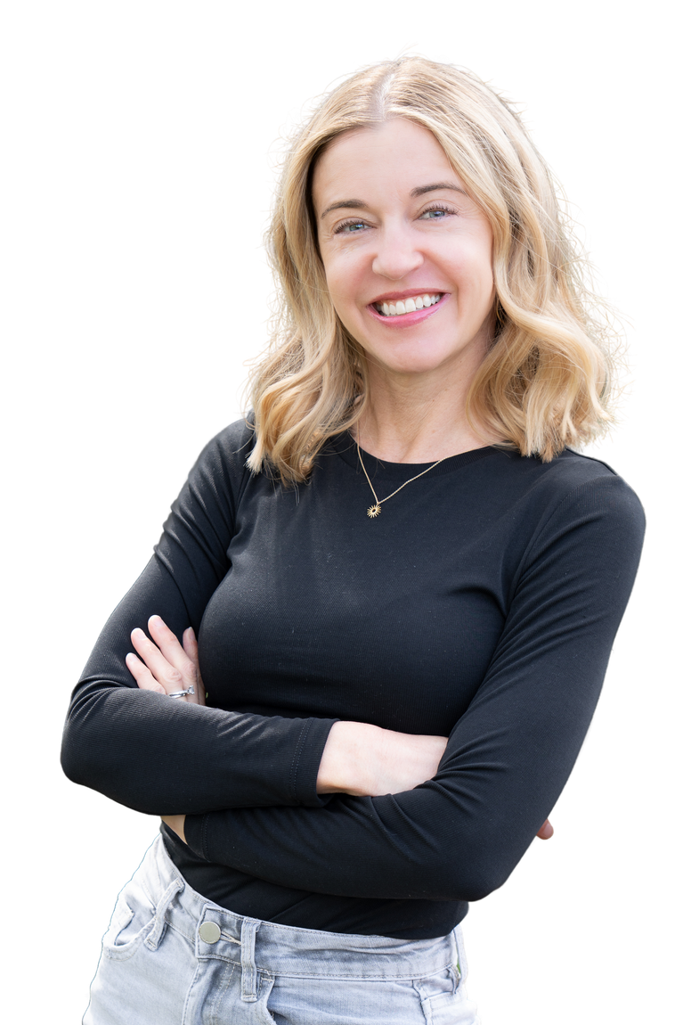 Sarah Newton poses in a black shirt with her arms folded and a friendly smile.