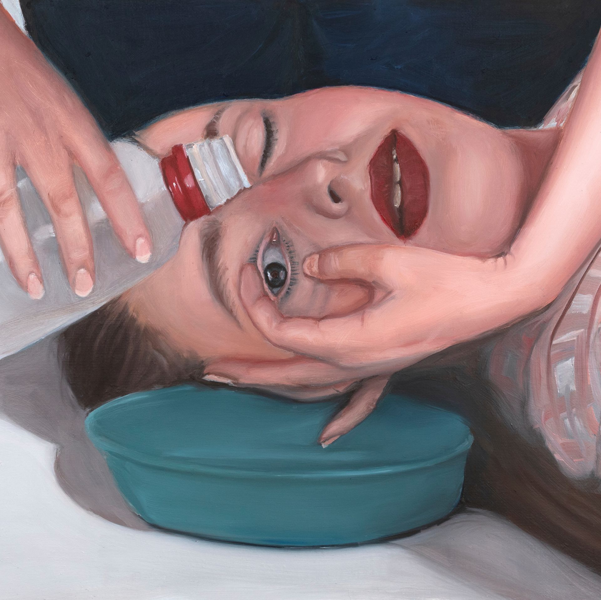 A woman with one eye open and one eye closed.
