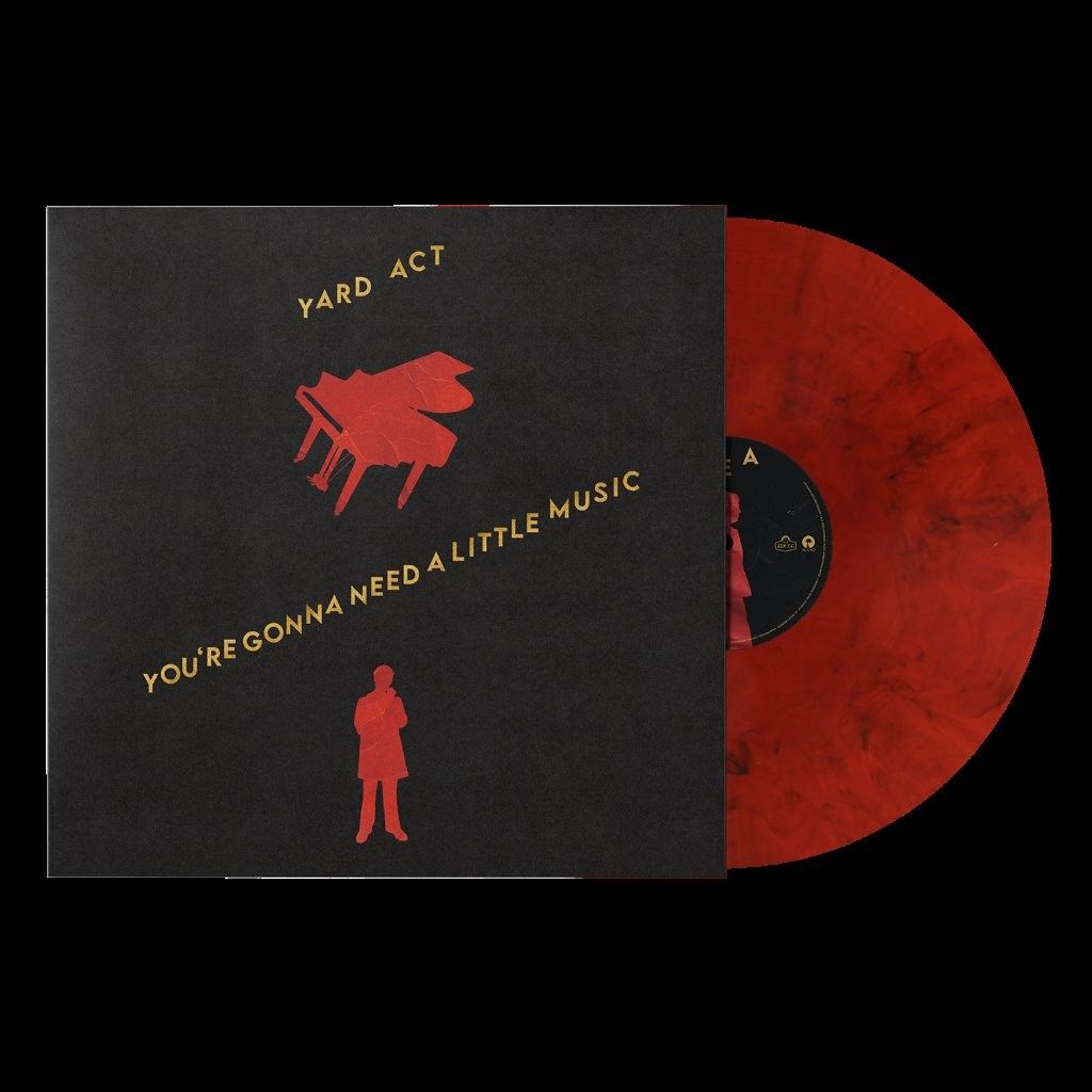 Red piano and a red man with yellow text