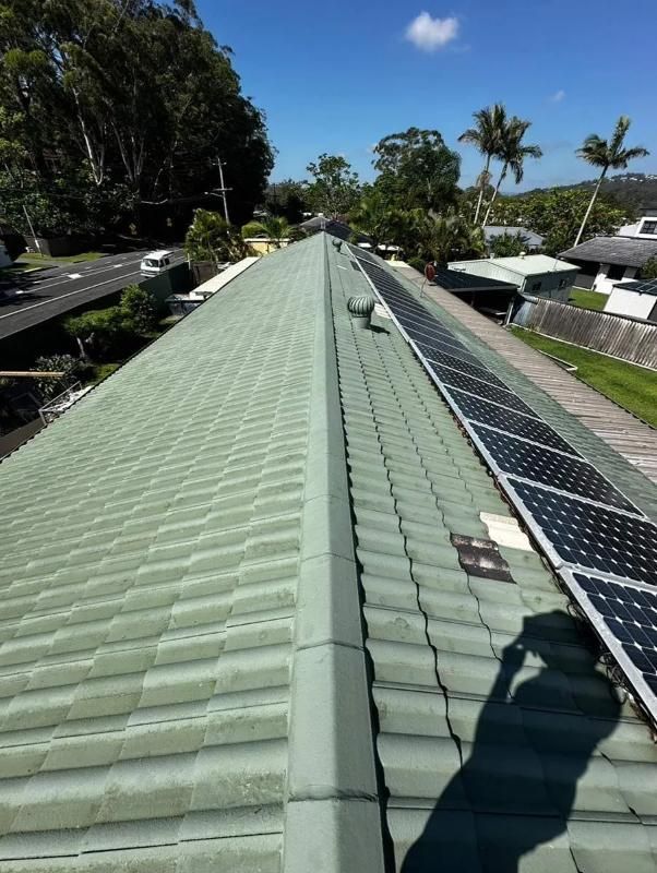 A Green Tiled Roof With Solar Panels On It — Clean Cartel Pressure Washing In Tweed Heads, NSW