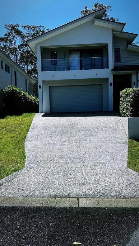 A Large White House With A Driveway Leading Up To It — Clean Cartel Pressure Washing In Gold Coast, QLD