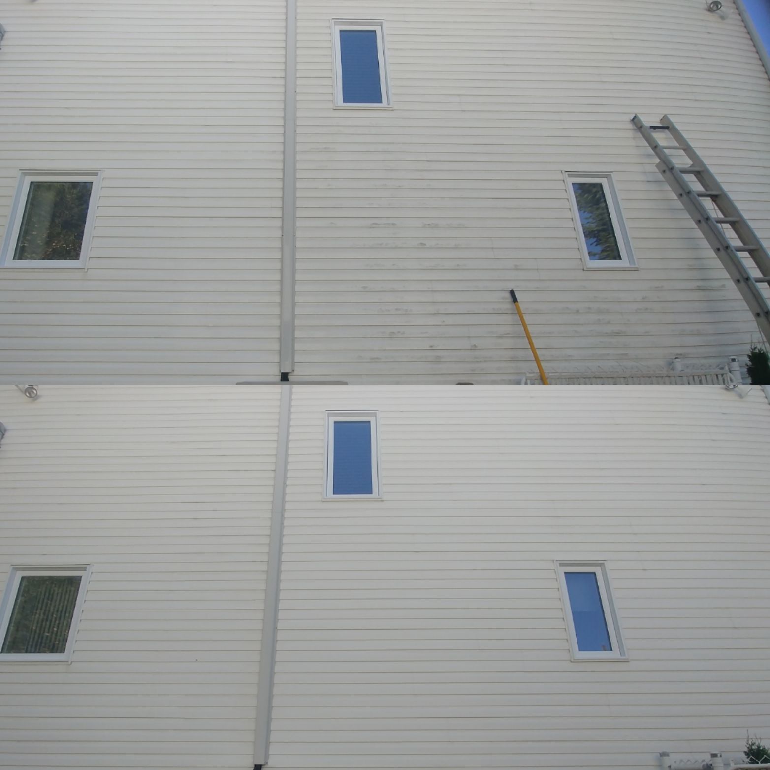 Un bâtiment blanc avec des fenêtres bleues et une échelle sur le côté