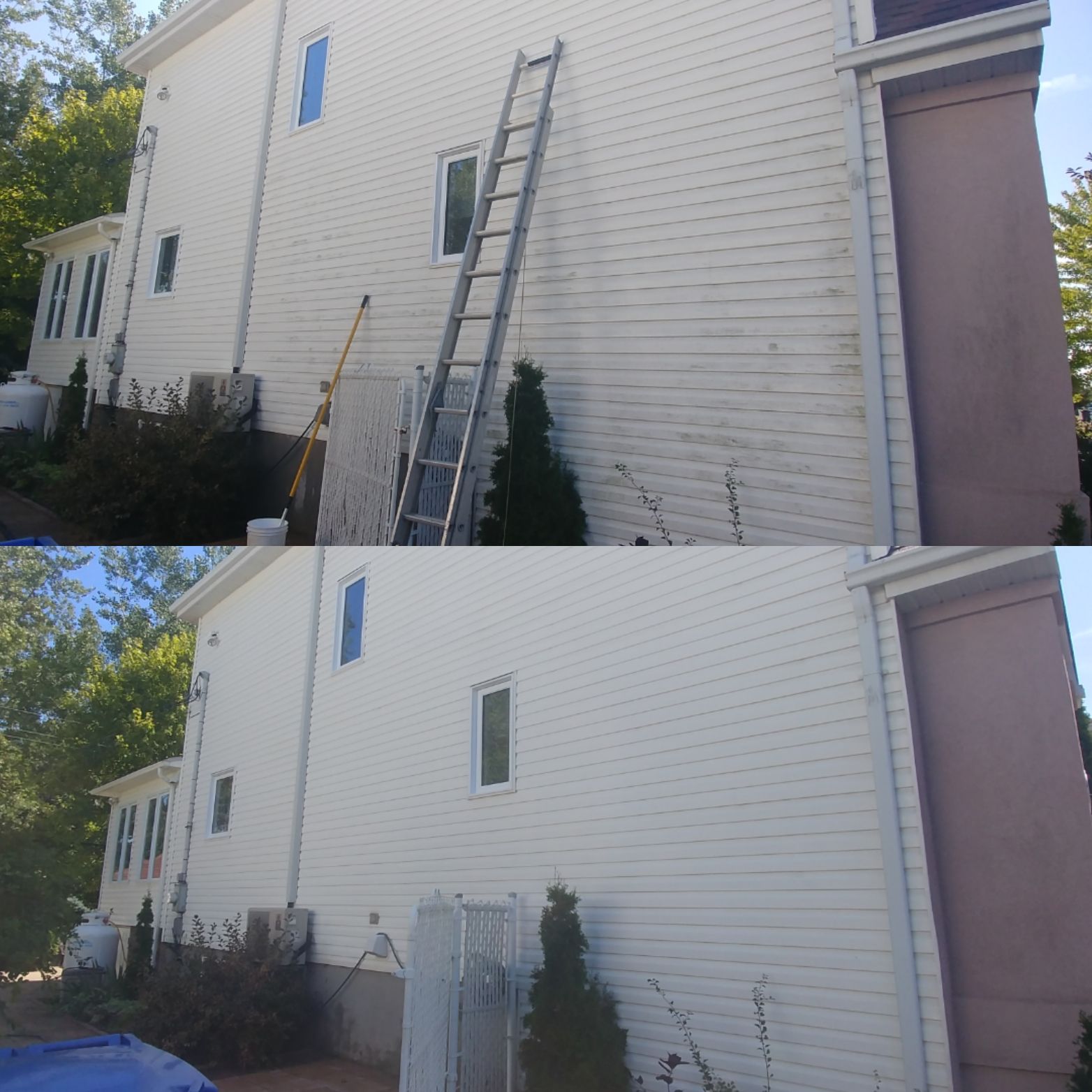 Une maison blanche avec une échelle sur le côté