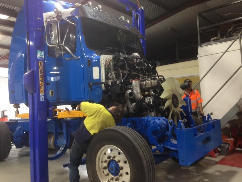 Man Repairing The Blue Truck — Towing Service In Walgett, NSW