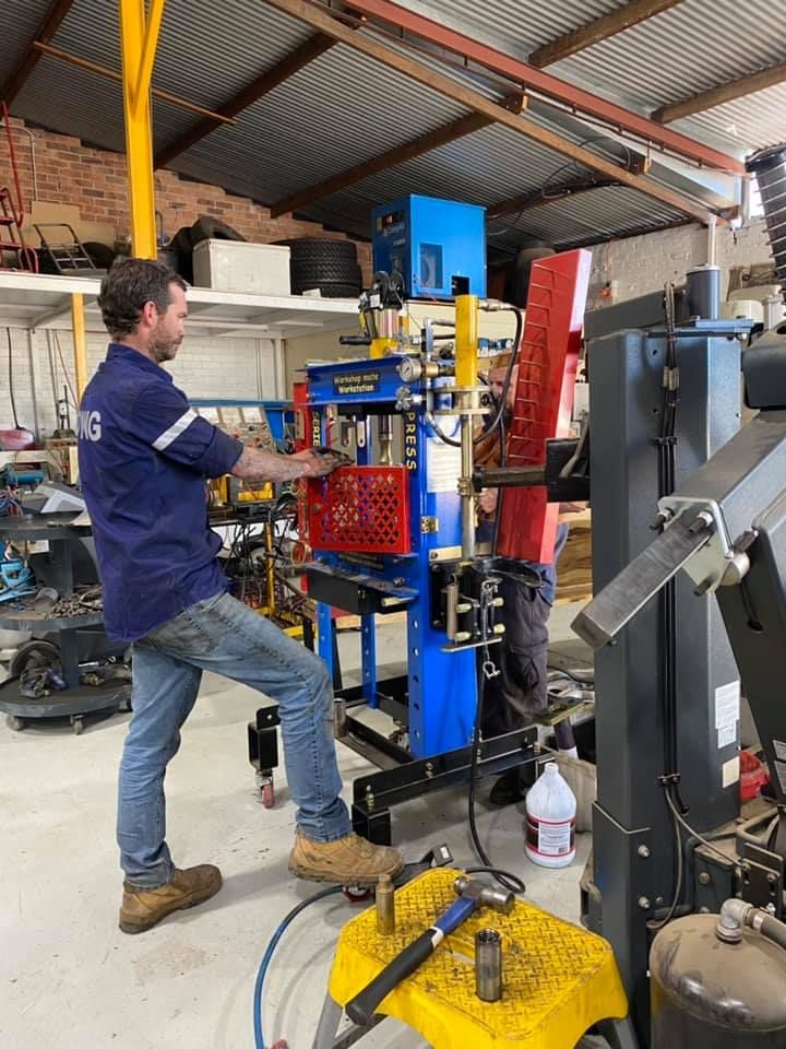 Man Checking The Machine — Towing Service In Walgett, NSW