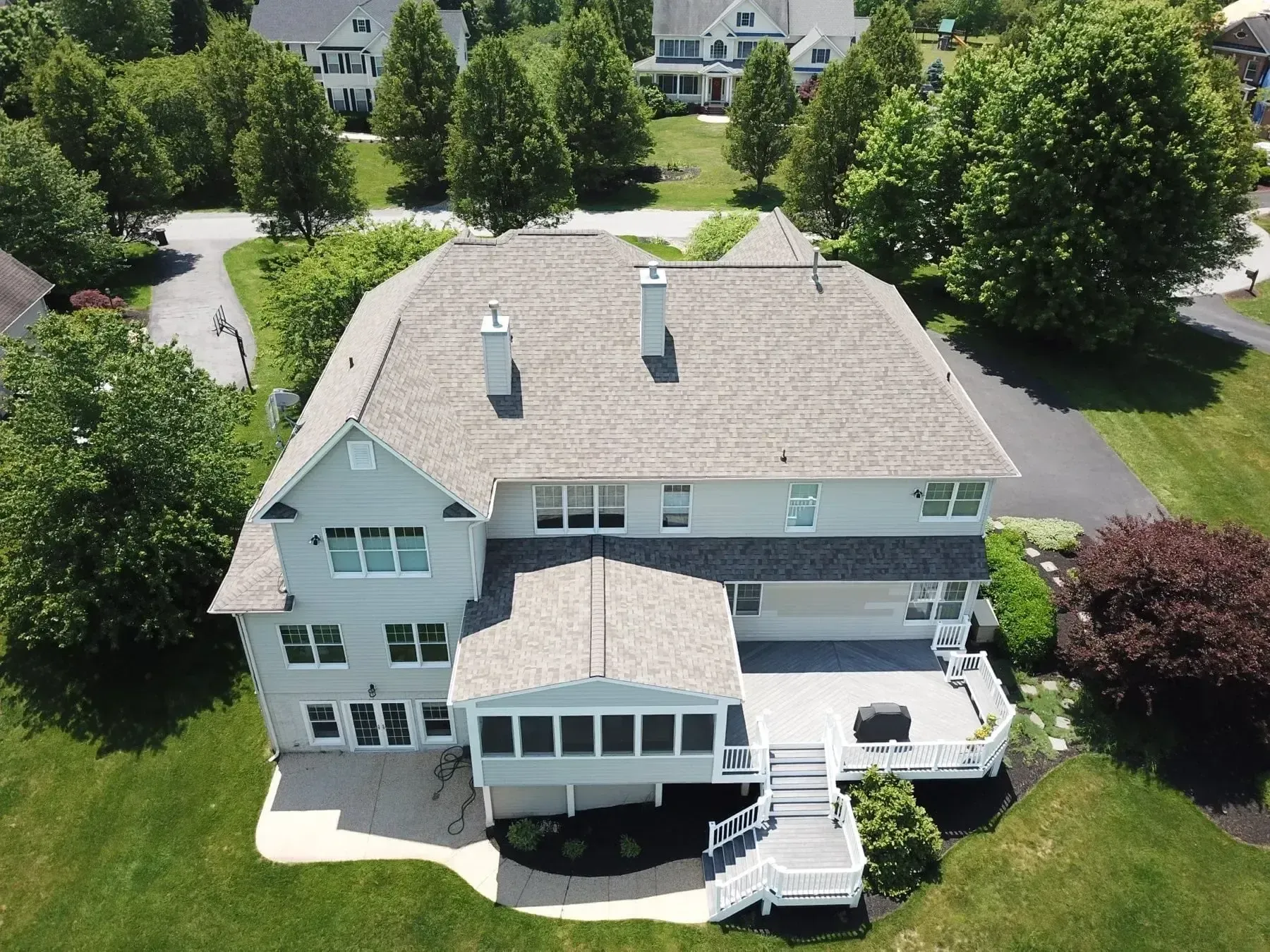 Maryland roof with light grey shingles and proper ventilation to reduce heat and improve energy efficiency