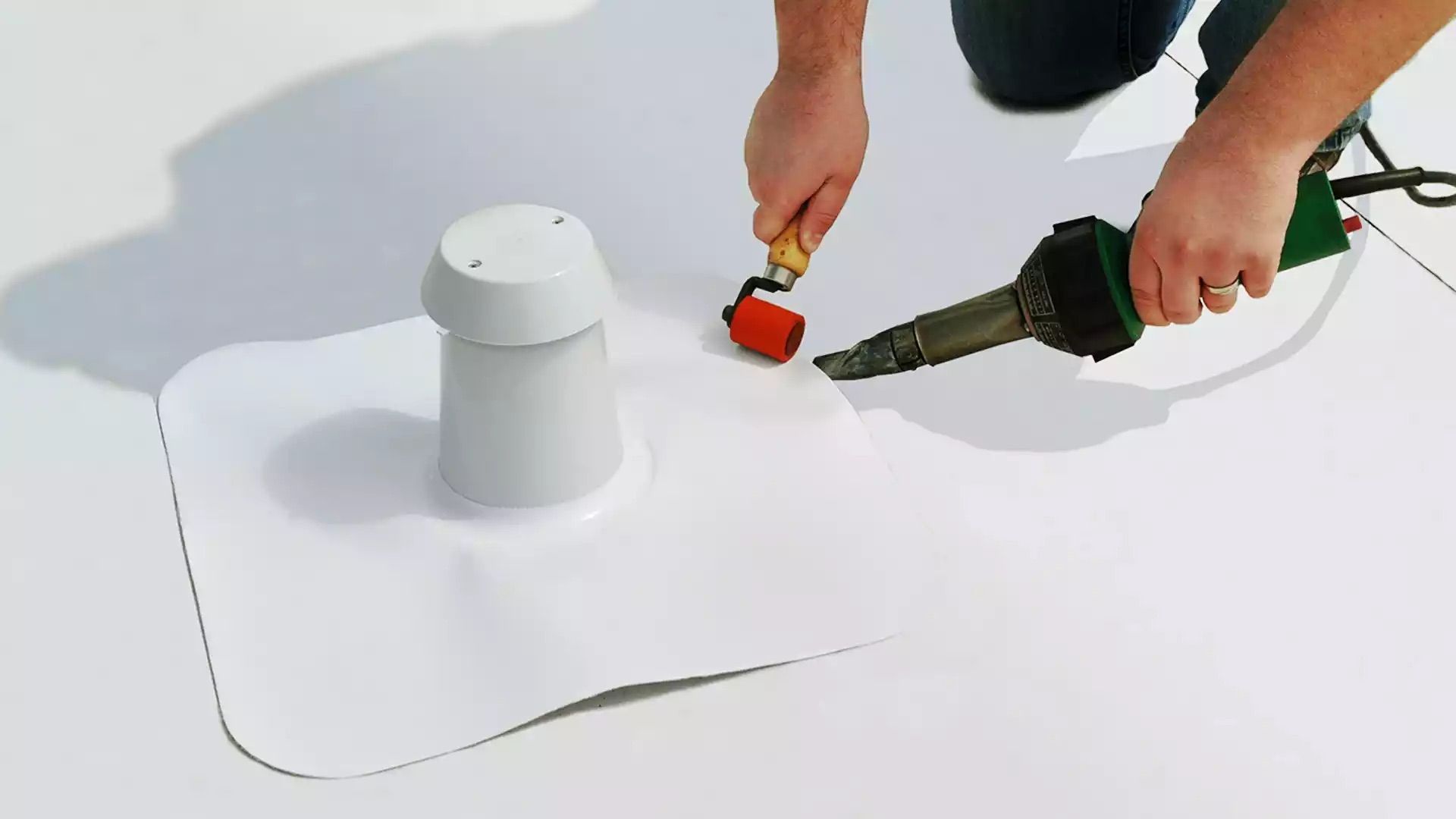 A person is using a tool to fix a hole in a roof.