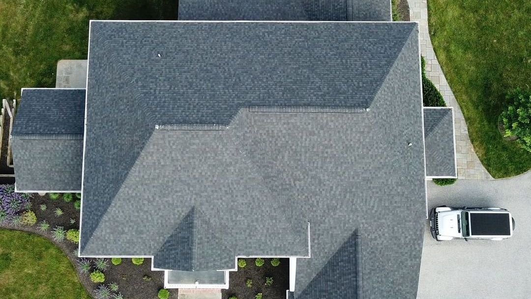 Aerial view of a newly completed roof by Four Seasons Roofing in Maryland