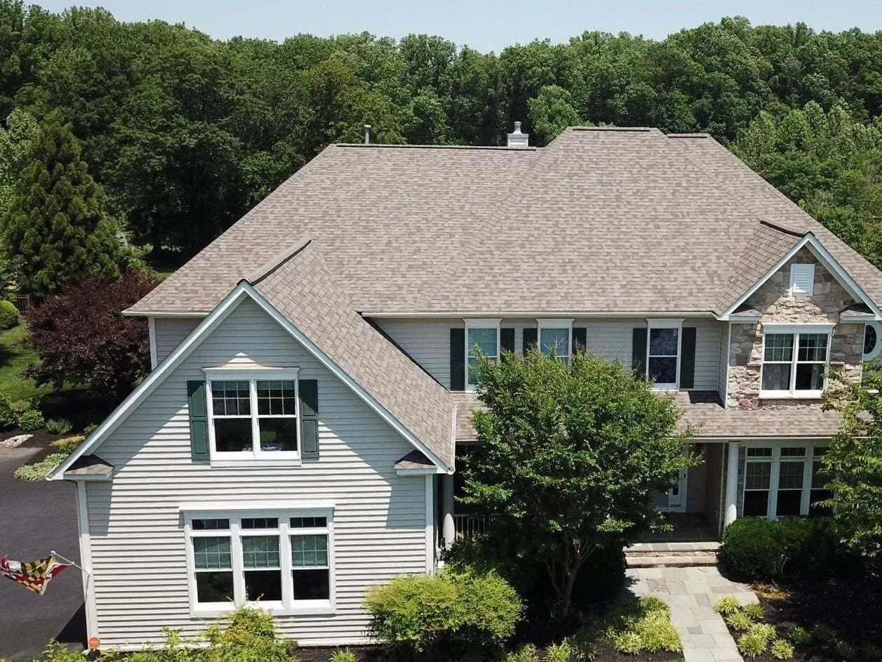 Professional roof replacement with new shingles installed by Four Seasons Roofing in Maryland