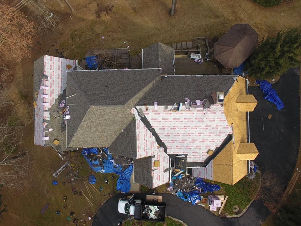 Overhead view of a roof replacement underway by Four Seasons Roofing in Maryland