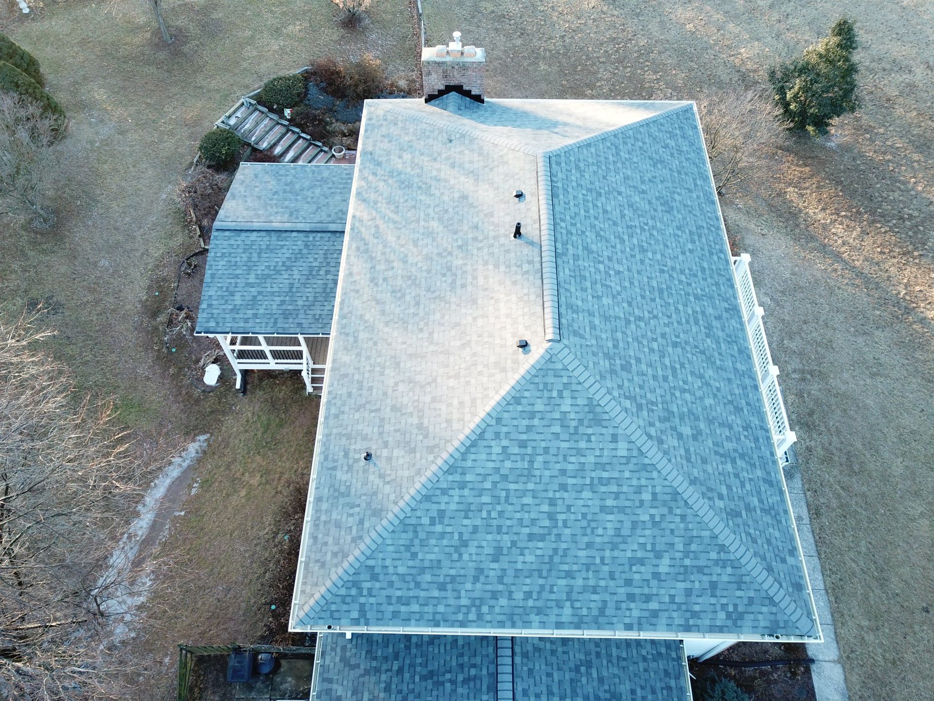 Old colonial home with a new roof replacement by Four Seasons Roofing a local roofer in Maryland