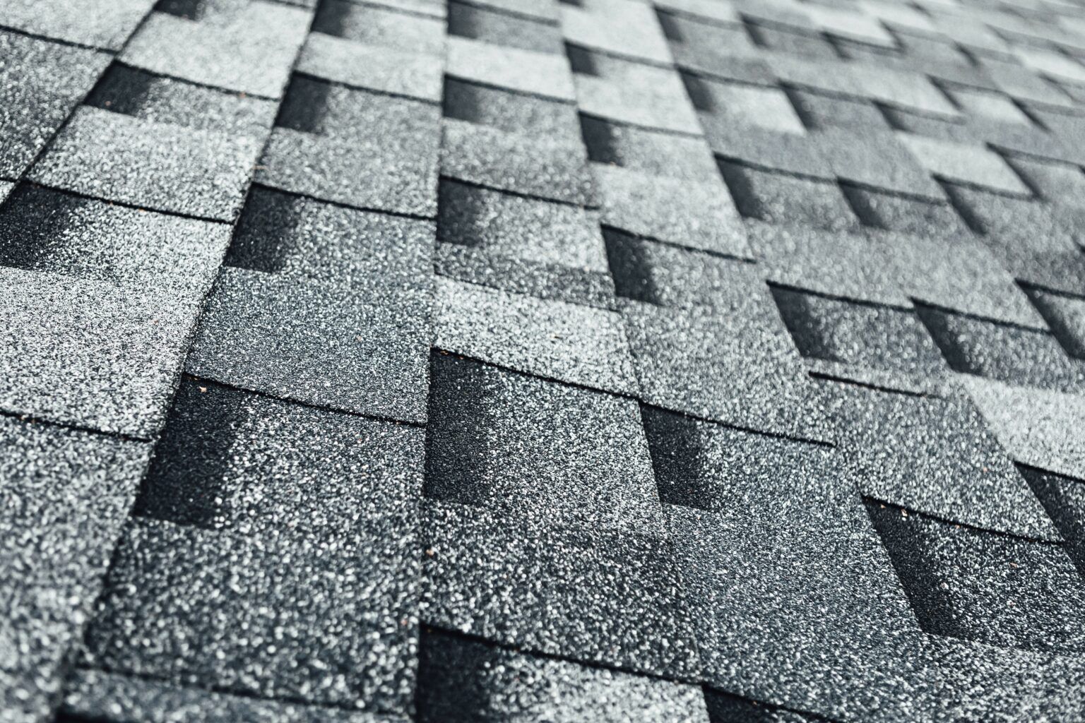 close up shot of asphalt shingles on a roof installation by Four Seasons 