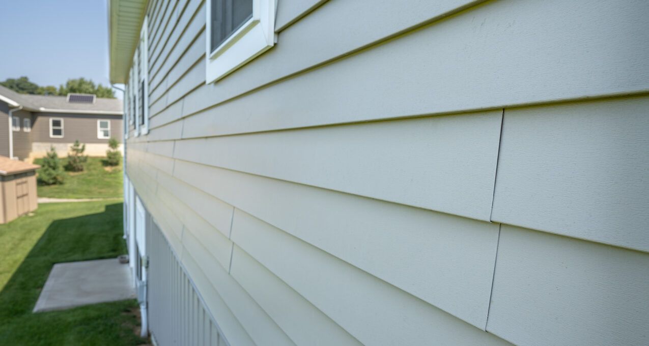 Close up view of a complete siding replacement completed with energy efficient siding