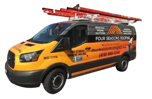 A yellow van with a ladder on top of it for four seasons roofing.