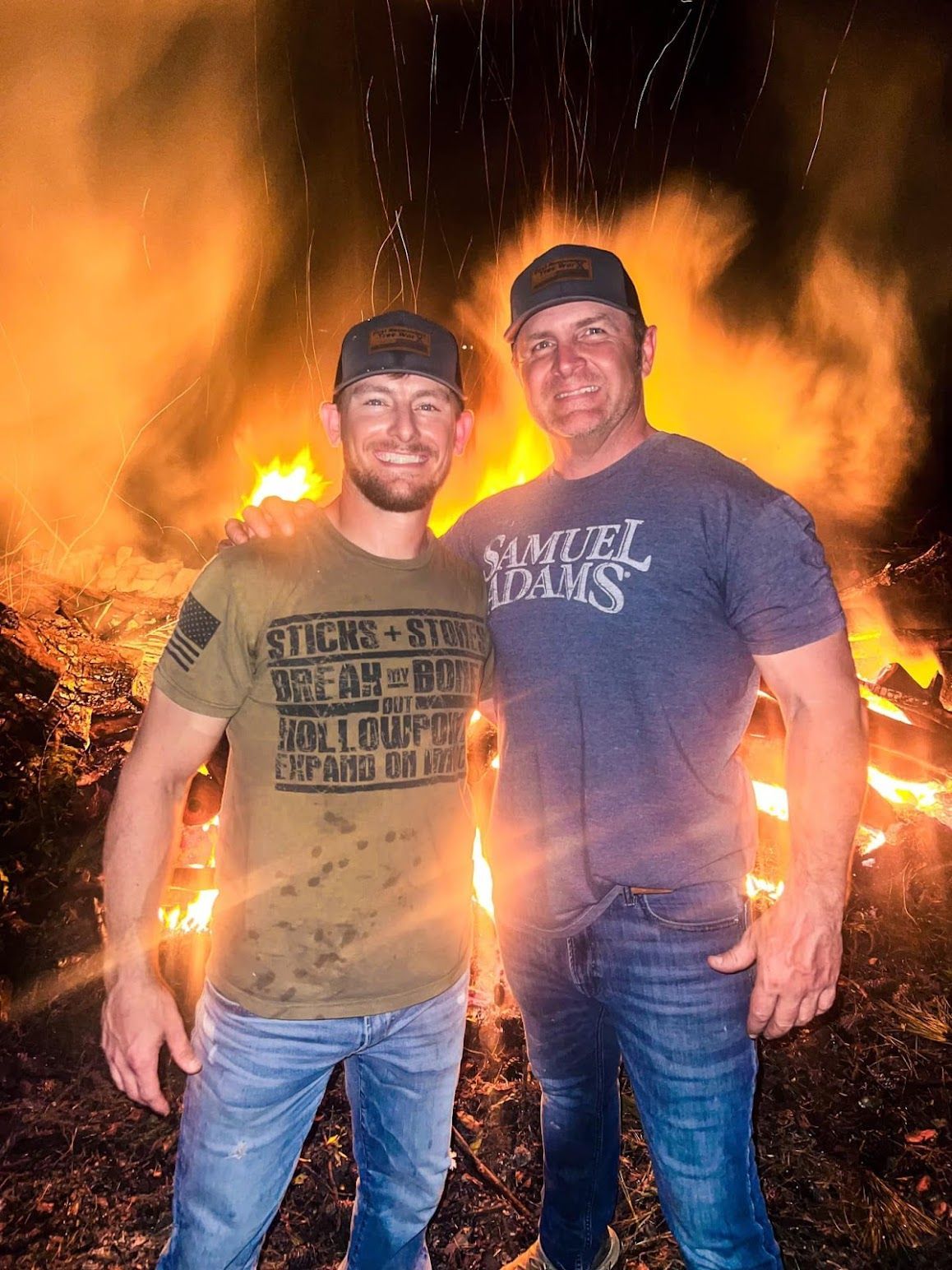 A pile of logs sitting on top of each other in a forest.