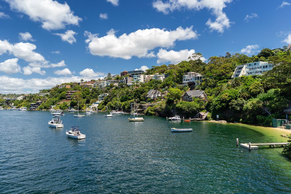 A Group Of Boats Are Floating On Top Of A Body Of Water — Charlestown Law Firm In Sydney, NSW