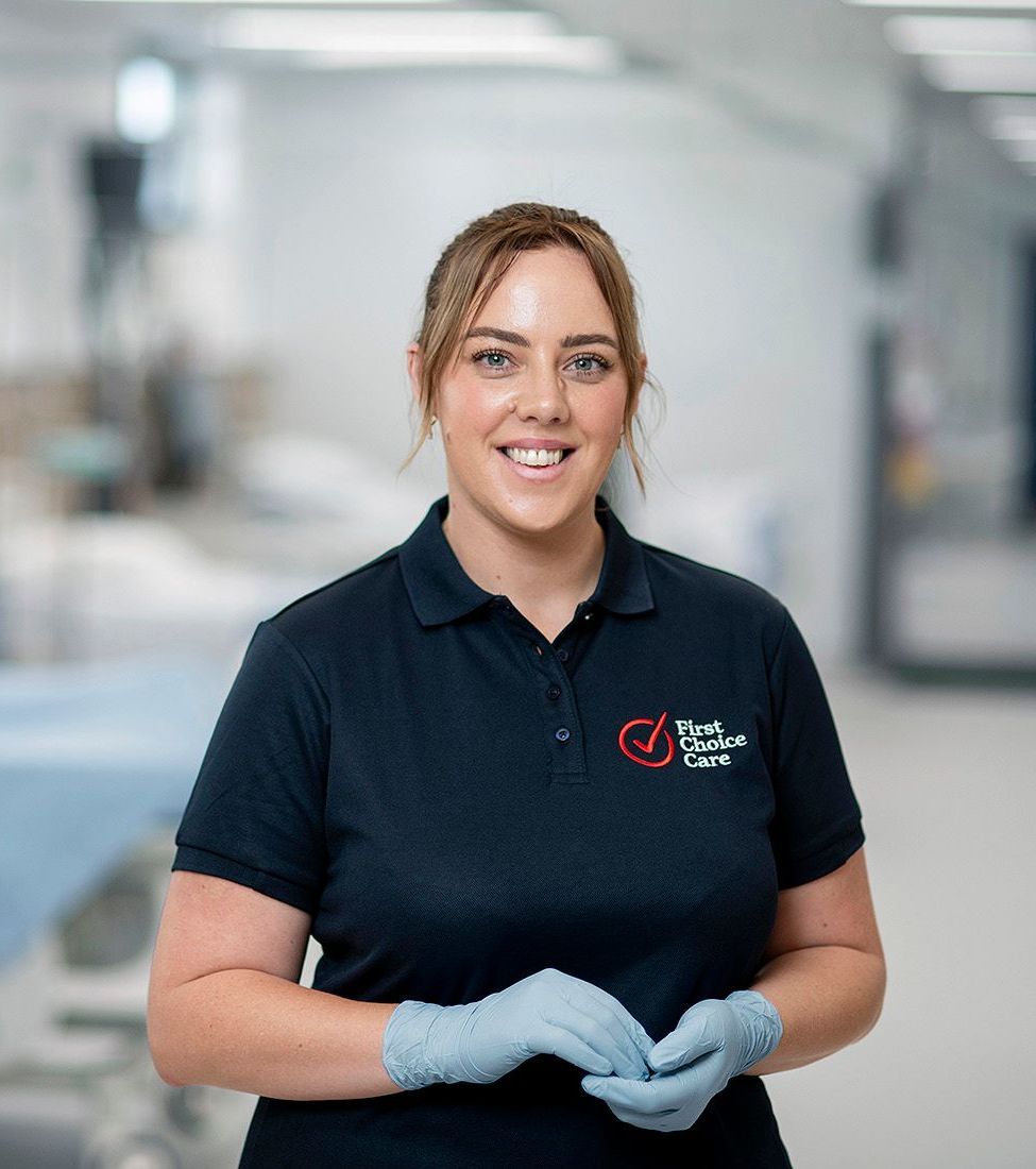 A surgeon is talking to another surgeon in a hospital room.