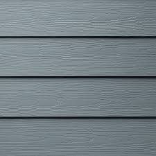 A close up of a gray siding on a house.