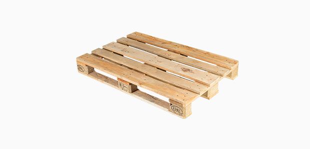 A wooden pallet is sitting on a white surface.