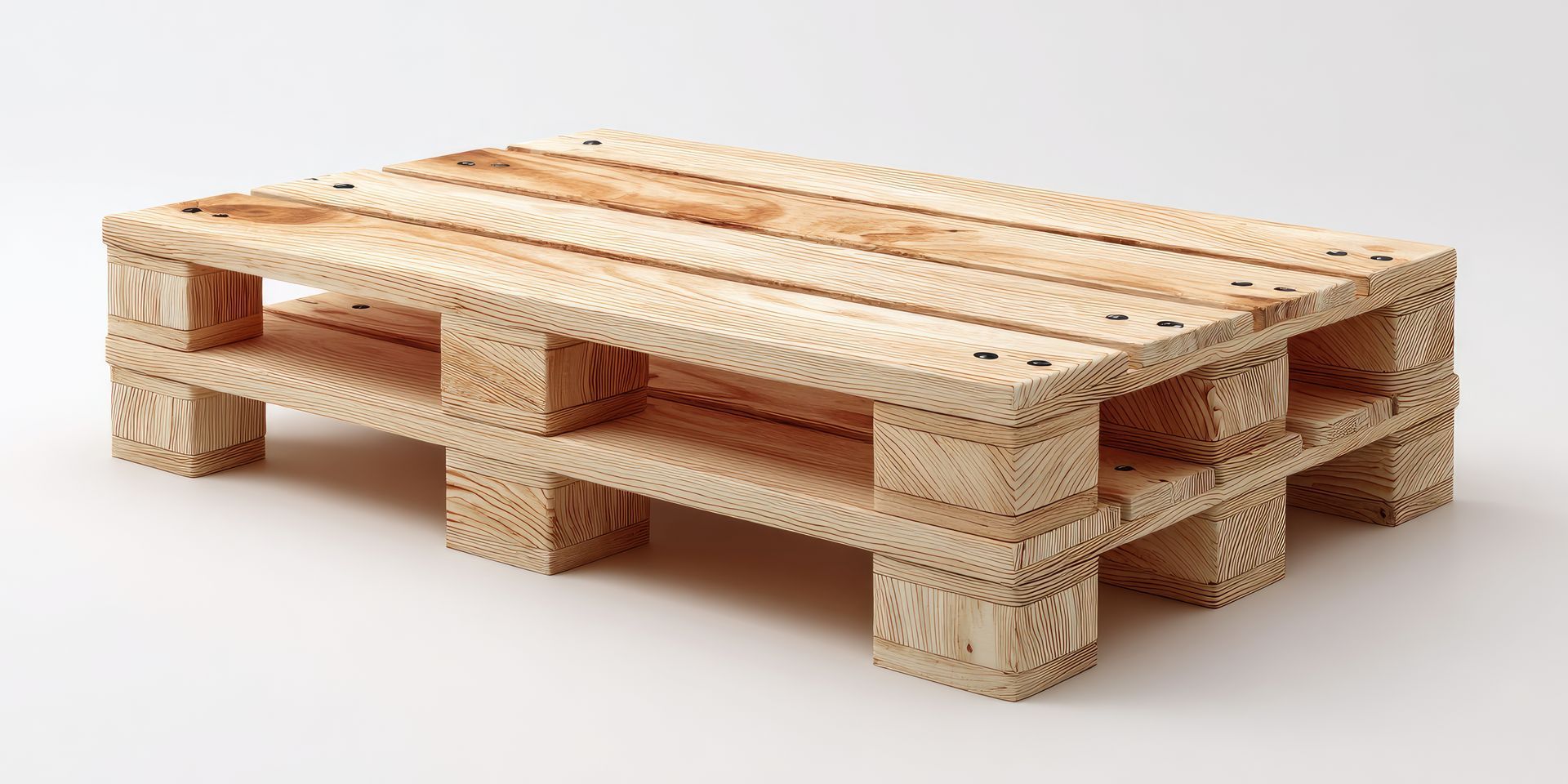 A wooden pallet is sitting on a white surface.
