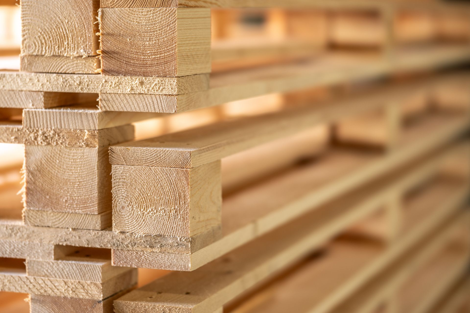 A wooden pallet is sitting on a white surface. A wooden pallet is sitting on a white surface.